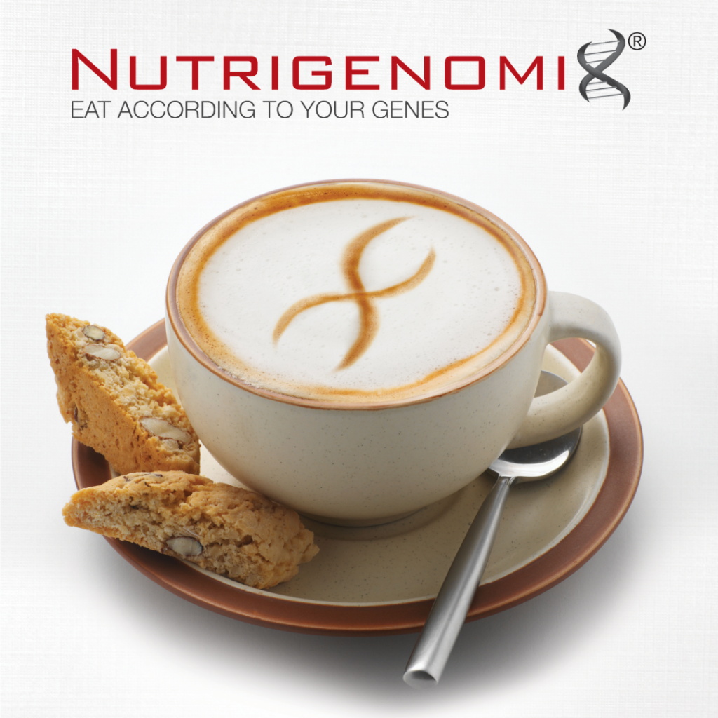 Nutrigenomix® testing and analysis is now being offered by ENERGIA VITA | The Trevors Clinic for Functional Health & Wellness, and this picture is of a latte in a white ceramic mug. It sits on a matching white saucer, with a silver spoon on the saucer to the right of the mug. To the left are two pieces of biscotti. Poured into the foam of the latte is artwork imitating the cross section of DNA that Nutrigenomix® is known for as it's logo.