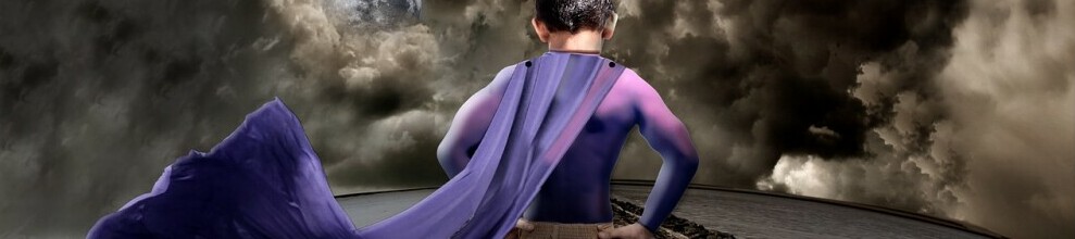 A young boy standing with his superhero cape flowing in the wind, representative of how Joe Trevors feels after having received his diagnosis that he now uses as a strength.